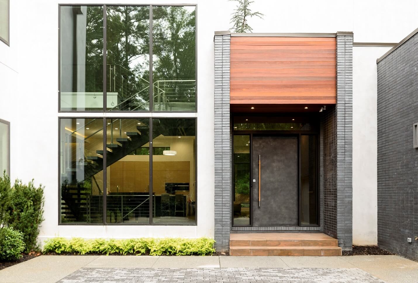 Home with a modern steel door installation by Scardino Doors.